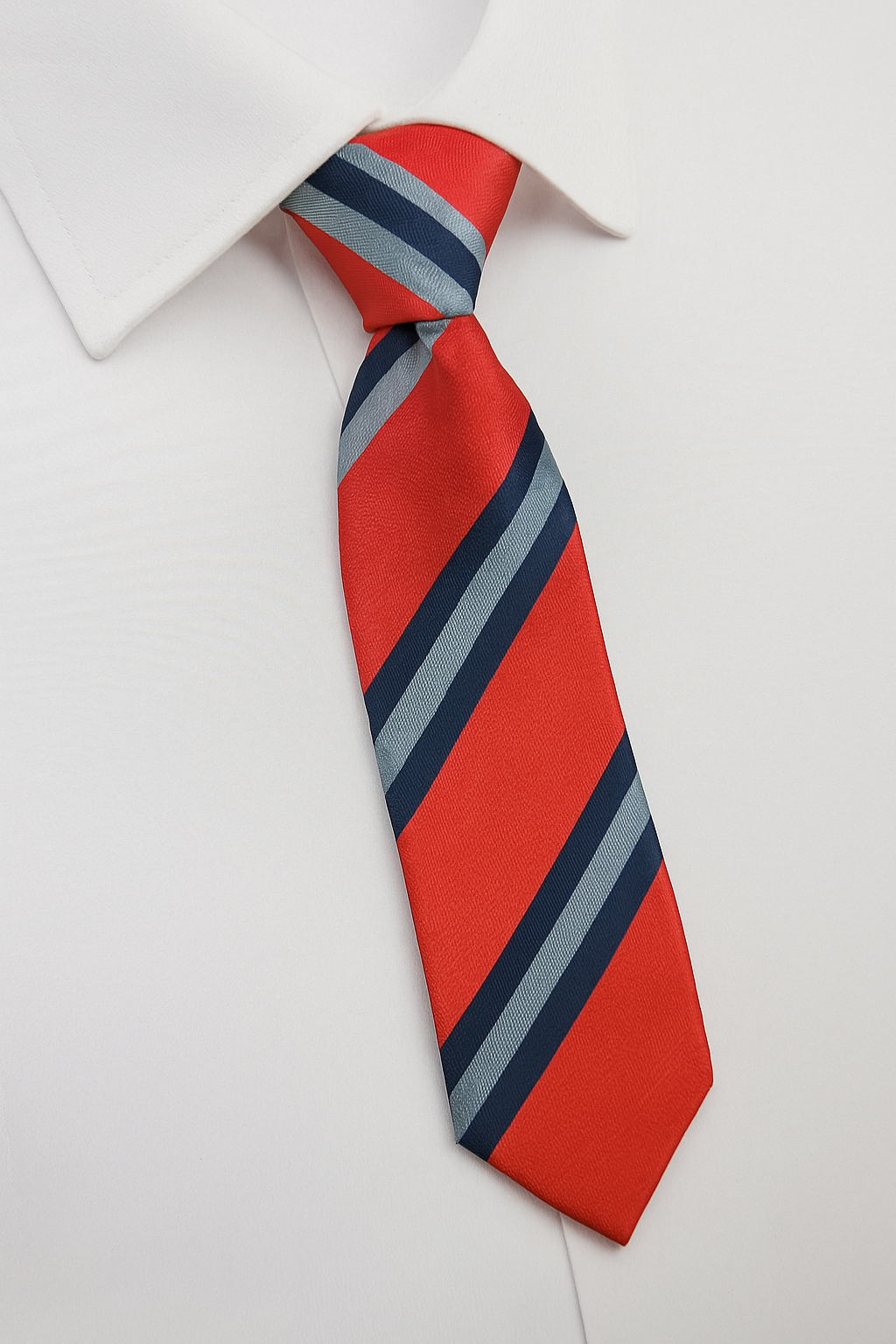 Holy Family Catholic Primary School Elastic Tie, featuring diagonal stripes, displayed knotted under a white dress shirt collar. Ideal for school uniform requirements.
