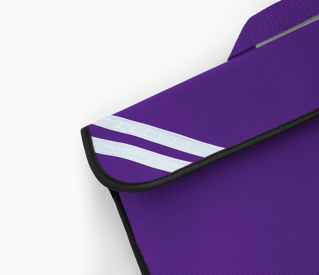 Close-up of the Infant Book Bag with reflective white stripes and black-bound edge on the flap, featuring reinforced corners and a visible purple shoulder strap.