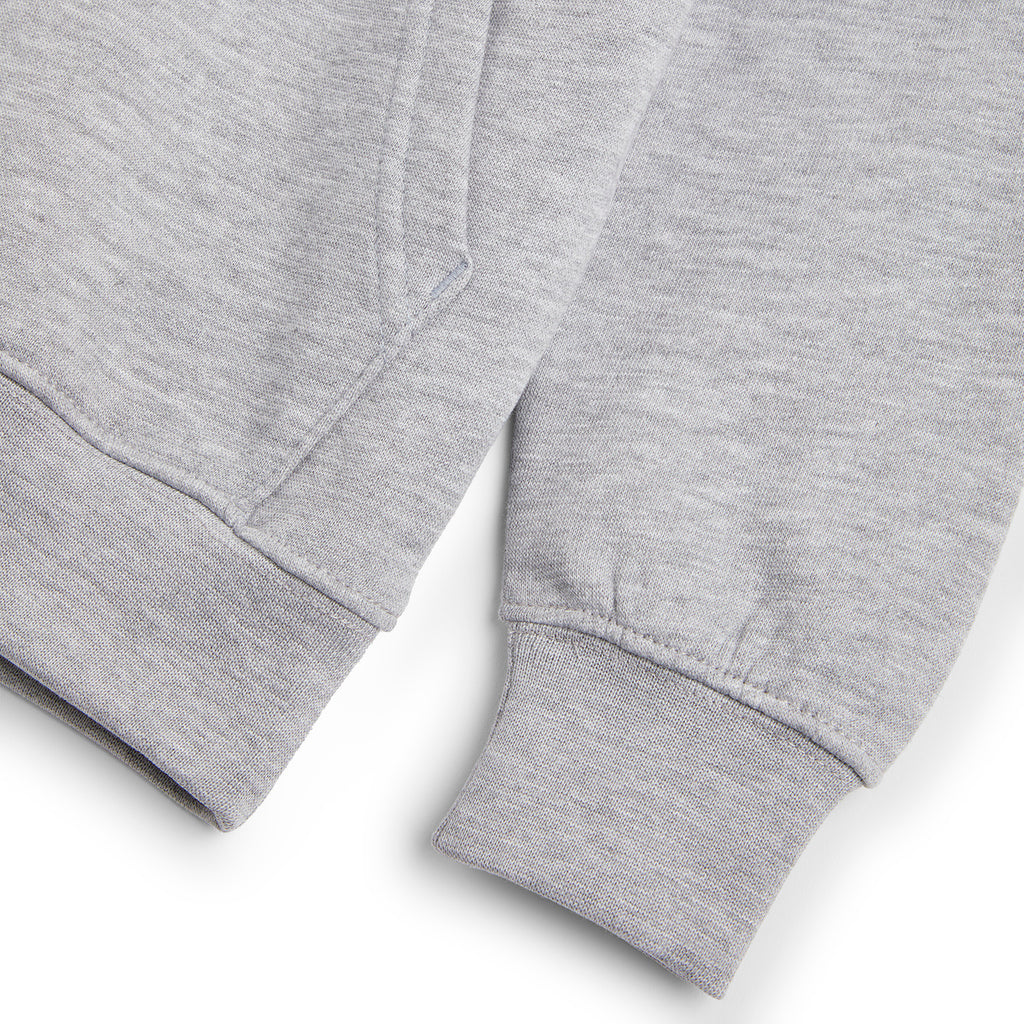 Close-up of a grey hoodie featuring a durable twin-needle neck, cuffs, and hems, with a front pocket and drop shoulder style, ideal for school wear.