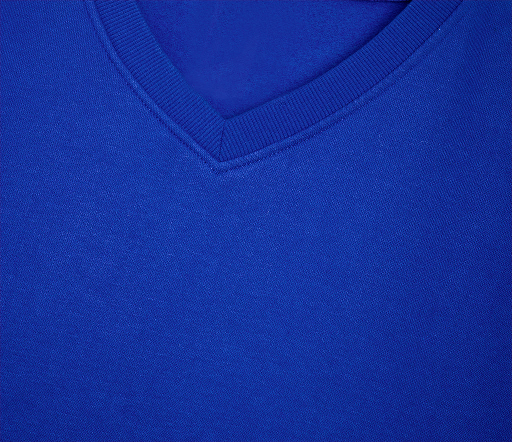 Close-up of the ribbed V-neck and upper chest of the V-Neck Sweatshirt - Royal Blue, showcasing its knit fabric and school-approved design.