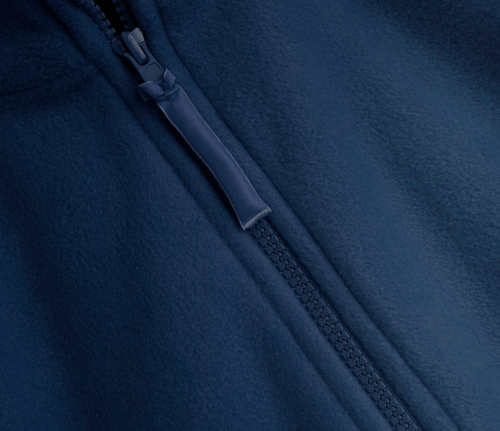 Close-up of Zeco Polar Fleece - Navy, featuring a diagonal YKK zipper with a fabric pull tab, showcasing the heavyweight, anti-pill fleece texture.